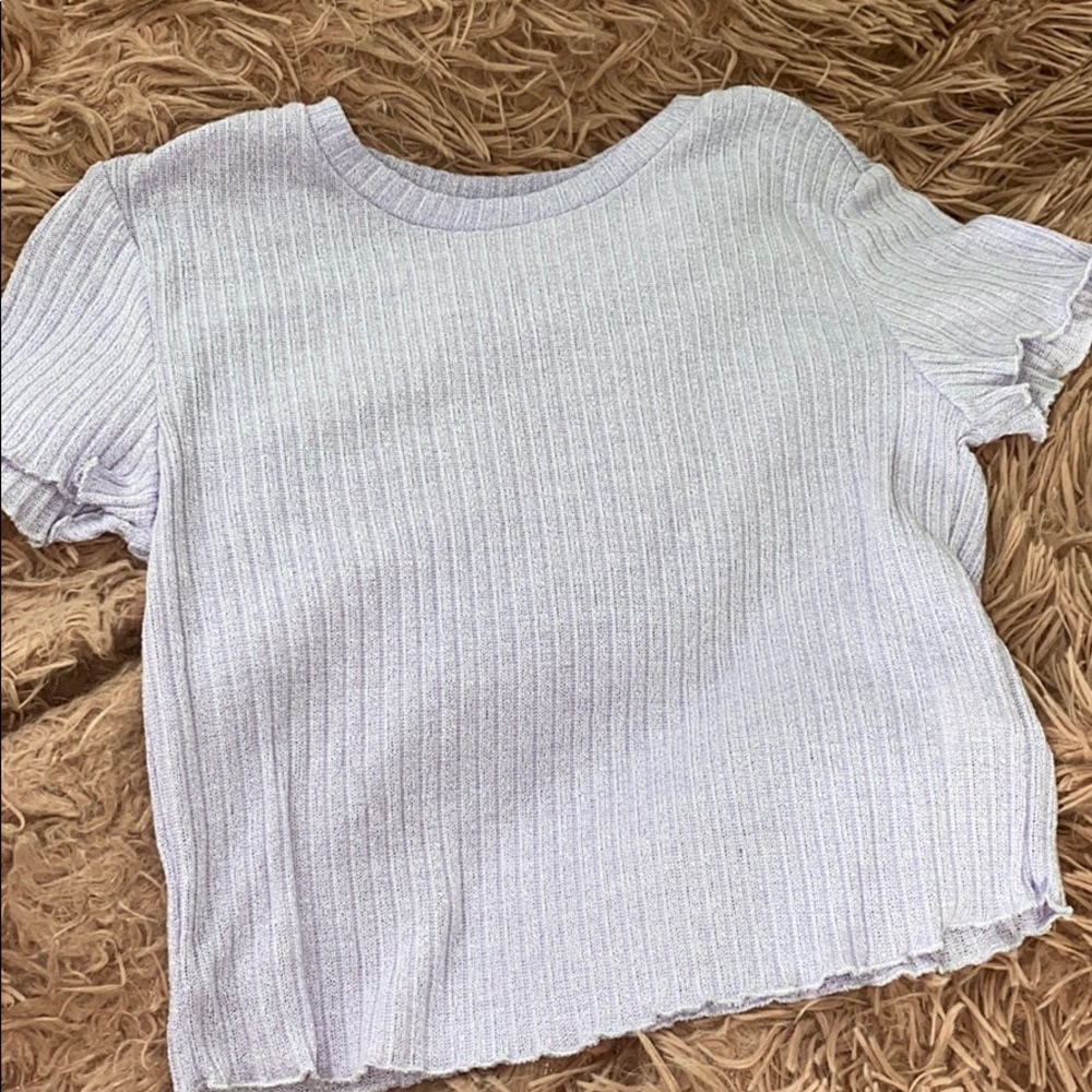 a ruffled purple shirt